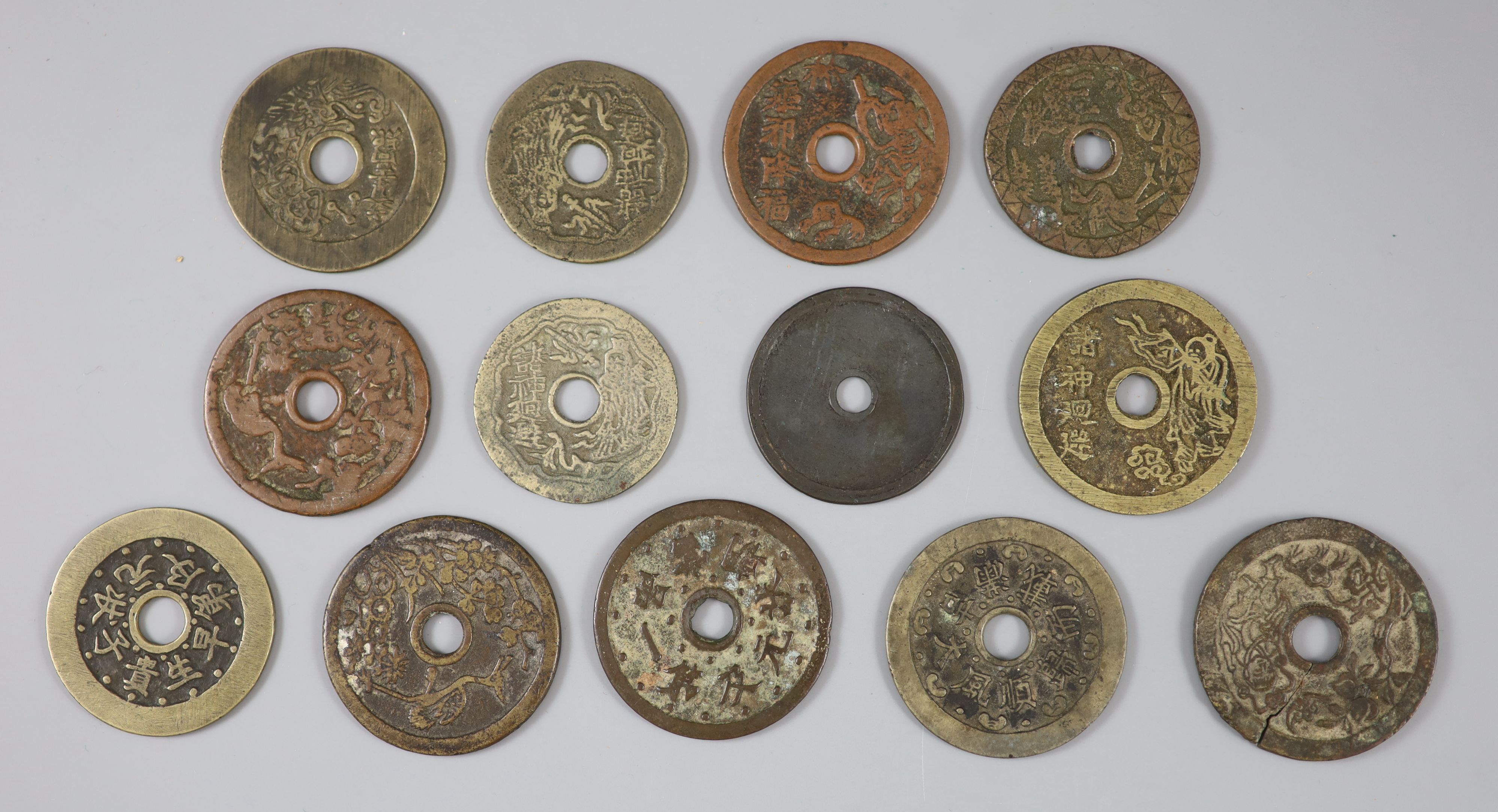 China, 13 cast bronze charms or amulets, Qing dynasty,